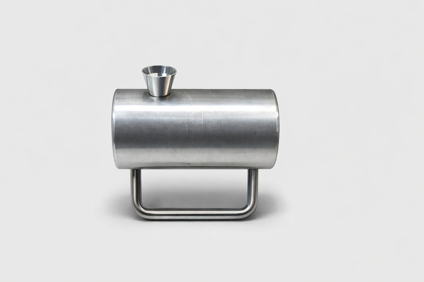 Polished handmade metal tobacco pipe with compact straight profile