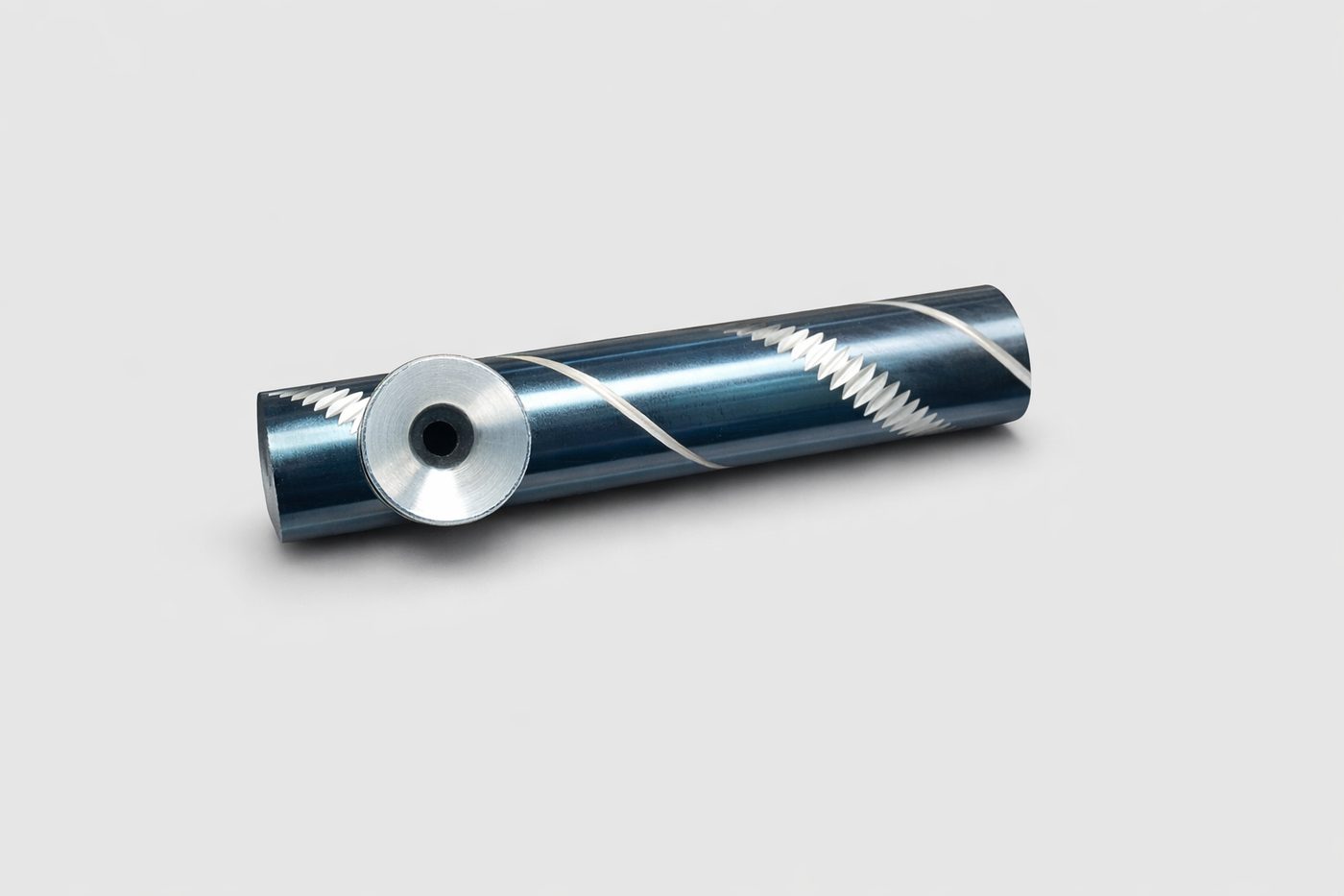 Handmade metal tobacco pipe with spiral patterned finish, second angle